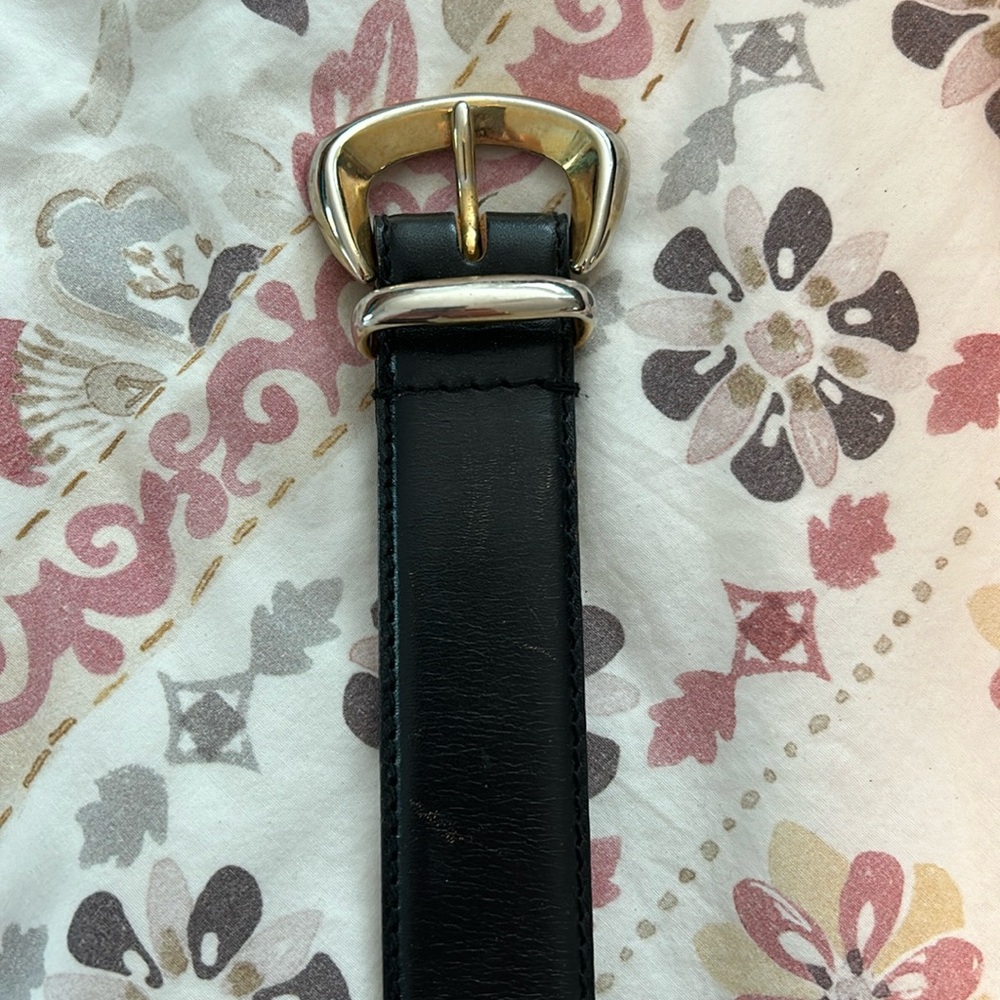 Black leather belt with gold buckle